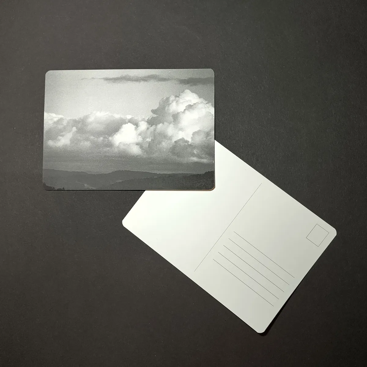 April Postcard - Dramatic clouds over the Emmental valley seen from Burgdorf Castle towards the Alps